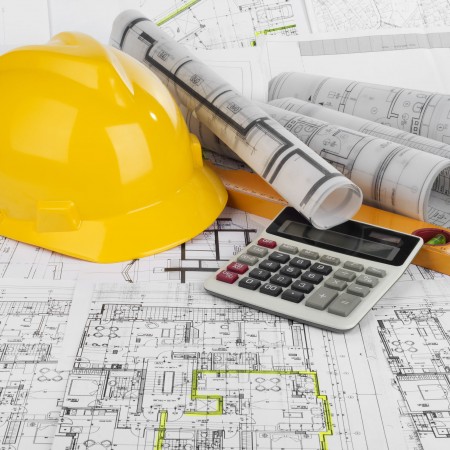 35996532 - yellow helmet, calculator, level and project drawings